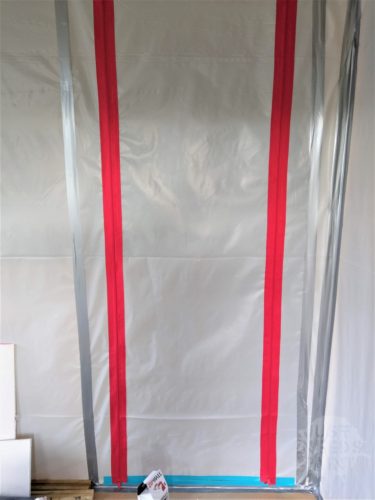 Zipwall zipper door in a pressure fit wall.